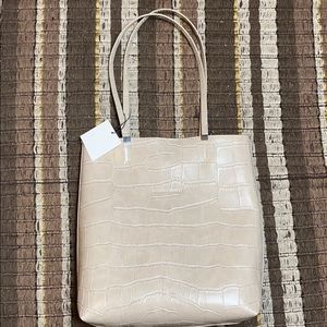 Beige, tote shaped Zara bag with mini card holder.